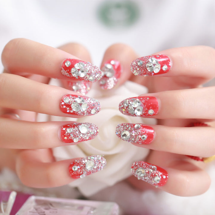 Artificials nails with sparkling rhinestone accents and elegant flower embellishments Bowlift