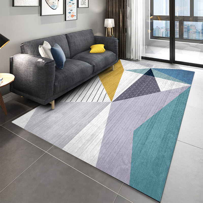 Casual living room rug Multi-colored geo print indoor rug Non-slip underside Washable easy-care rug | Bowlift