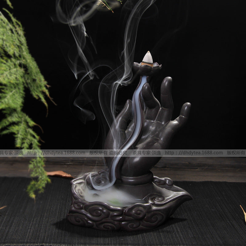 Hand-shaped ceramic incense holder