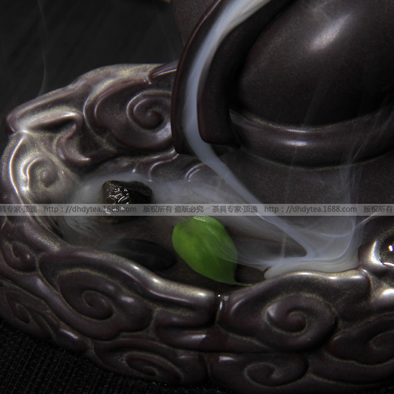 Hand-shaped ceramic incense holder
