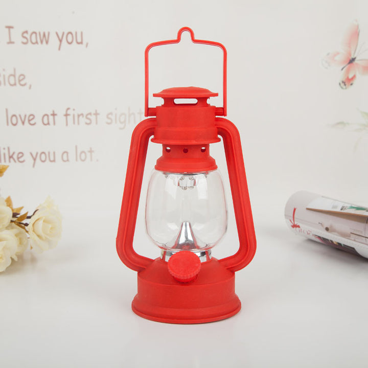 Portable rechargeable LED hurricane lantern with hanging handle and clear glass globe Bowlift