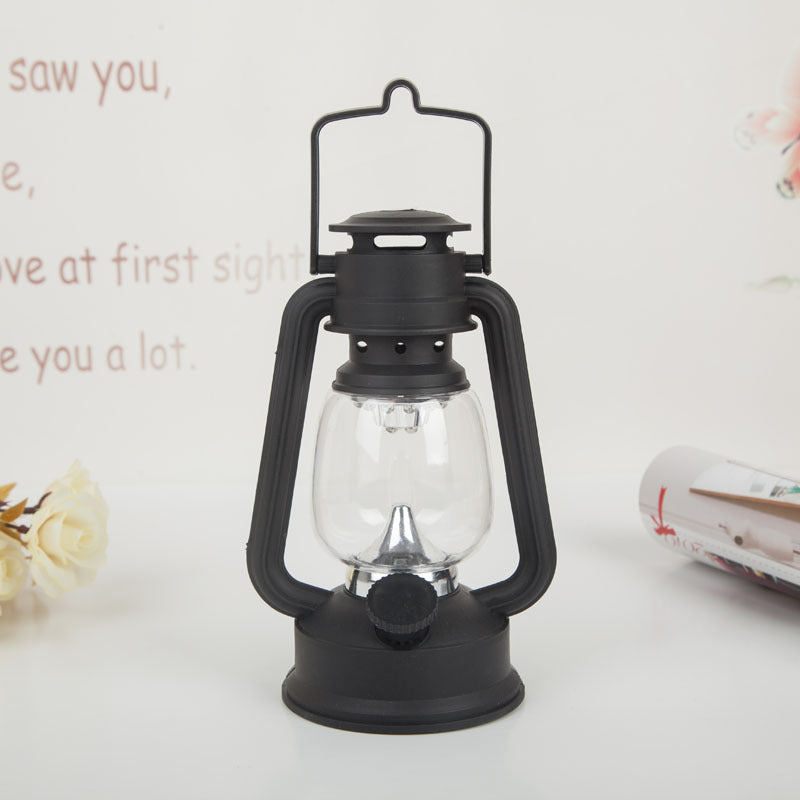 Portable rechargeable LED hurricane lantern with hanging handle and clear glass globe Bowlift