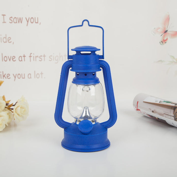 Portable rechargeable LED hurricane lantern with hanging handle and clear glass globe Bowlift