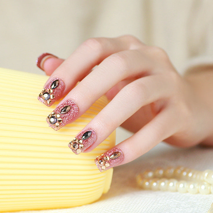 Glamorous artificial nails with glitter and jewelry decoration Bowlift