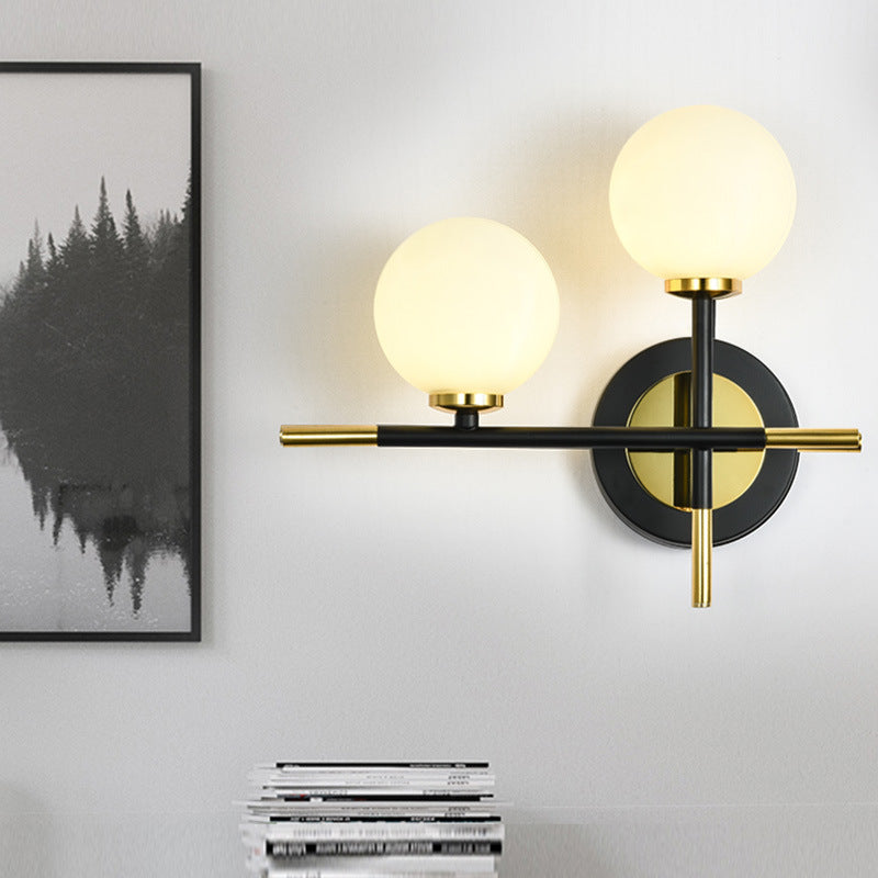 BowLift | Milk glass orb wall light with cross design 2 lights modern black and brass wall light