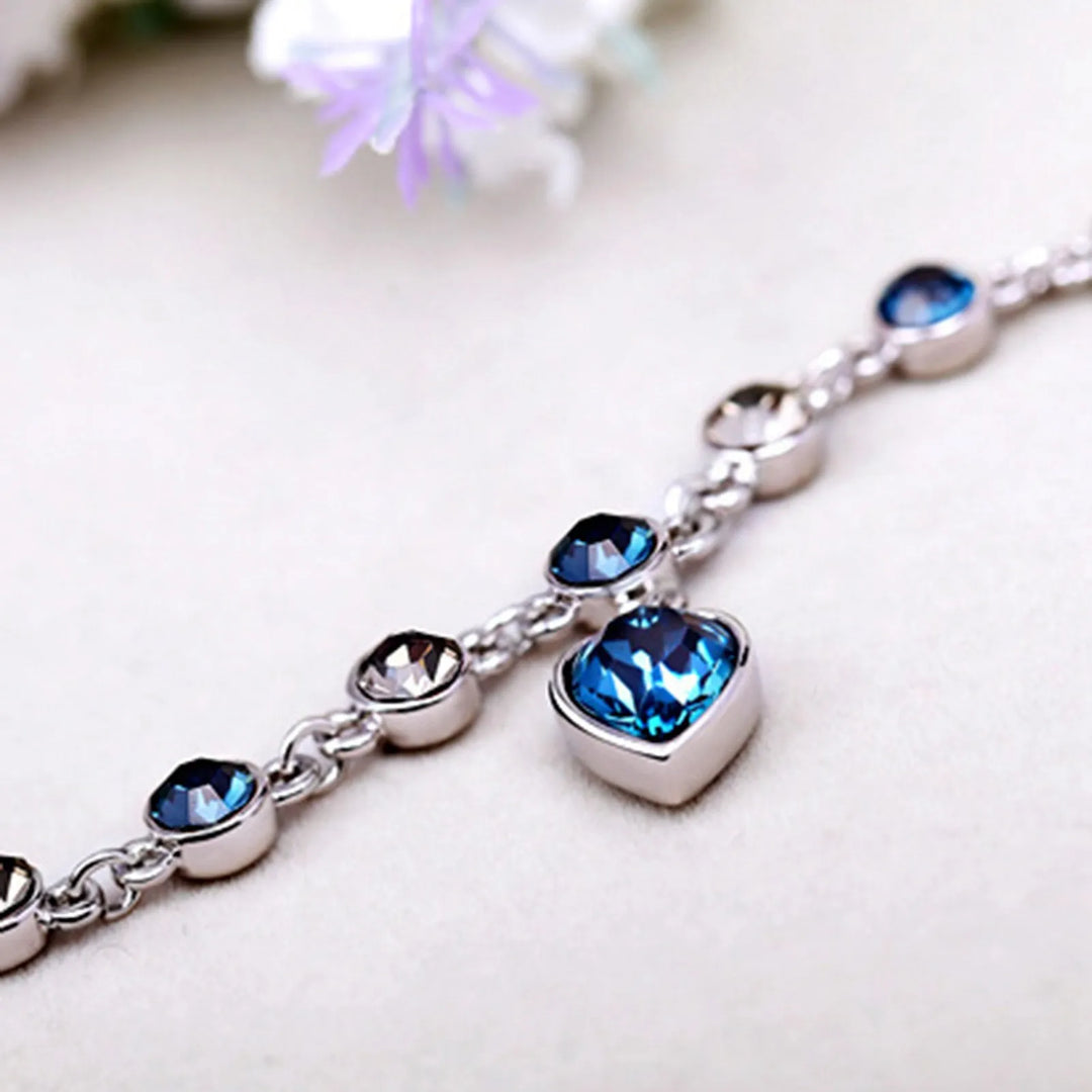 Enchanting Ocean Heart Crystal Bracelet with Radiant Blue Heart Charm Bowlift