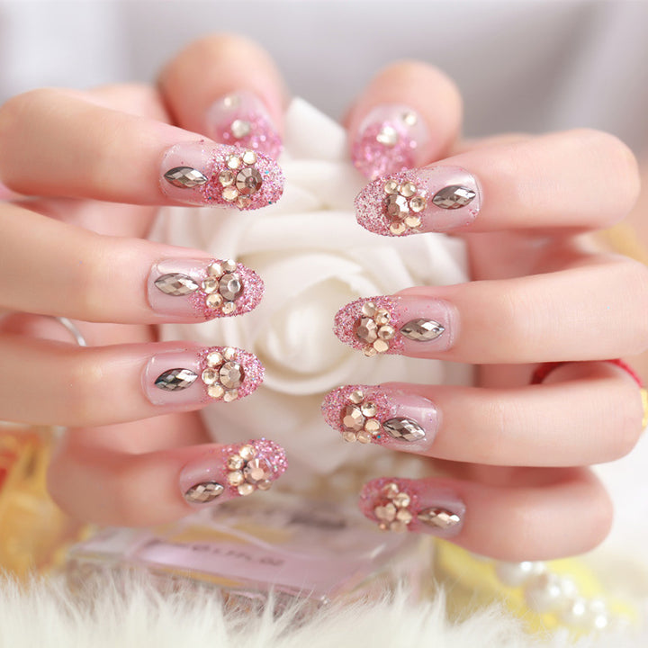 Glamorous artificial nails with glitter and floral elements Bowlift