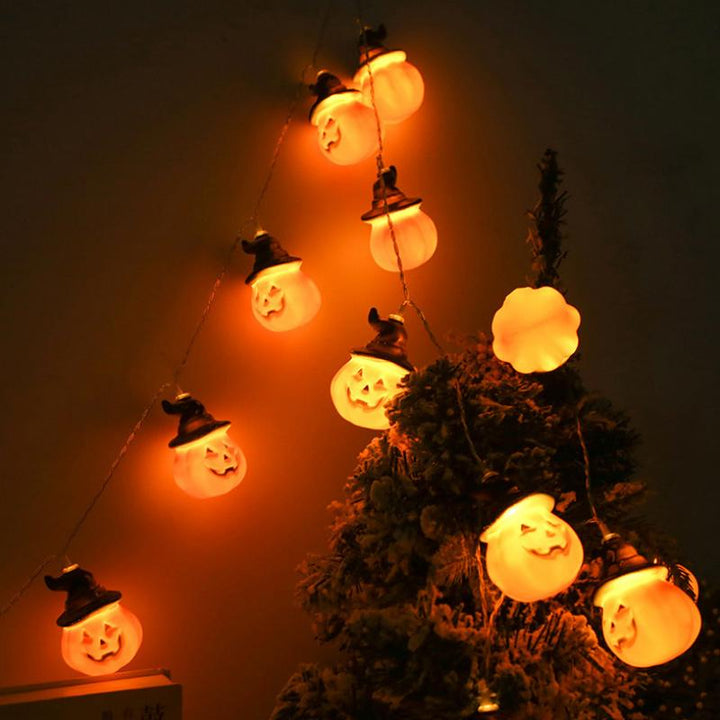 Glowing pumpkin garland Halloween with witch hats | Bowlift