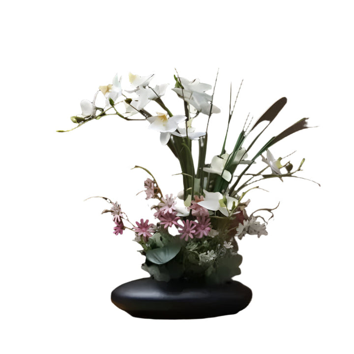 Lifelike flower arrangement in a modern vase Bowlift