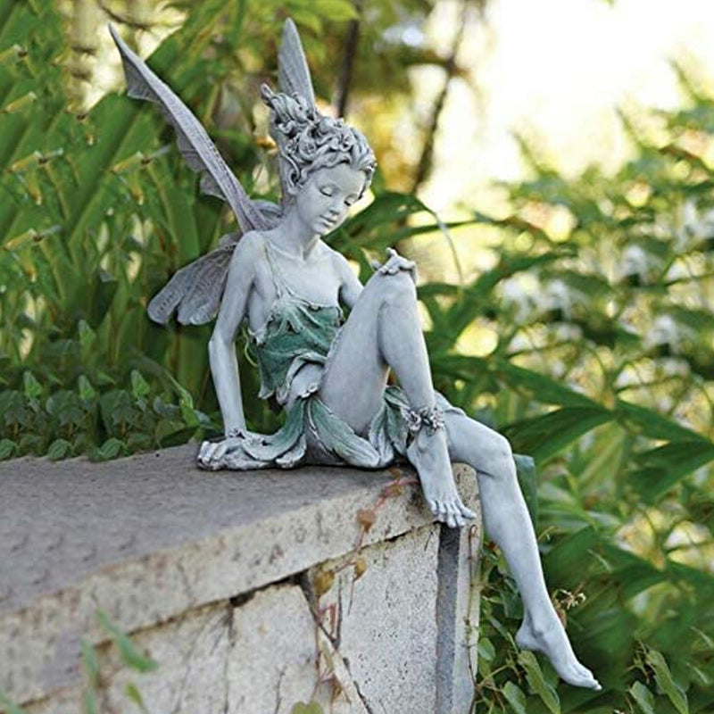 BowLift | Statue of sitting fairy in the garden