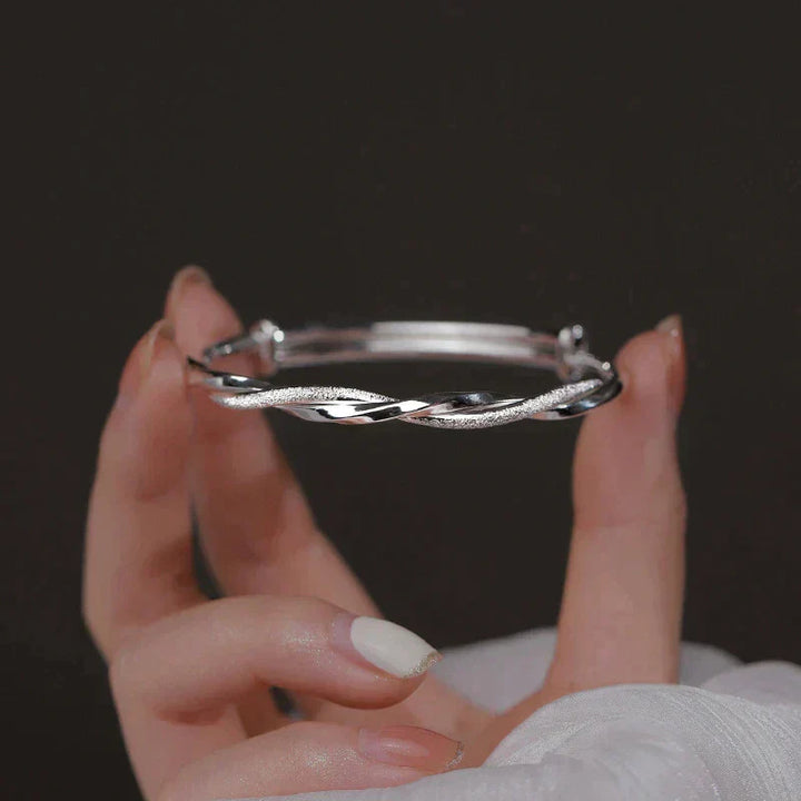 Elegant Twisted Silver Bracelet Bowlift
