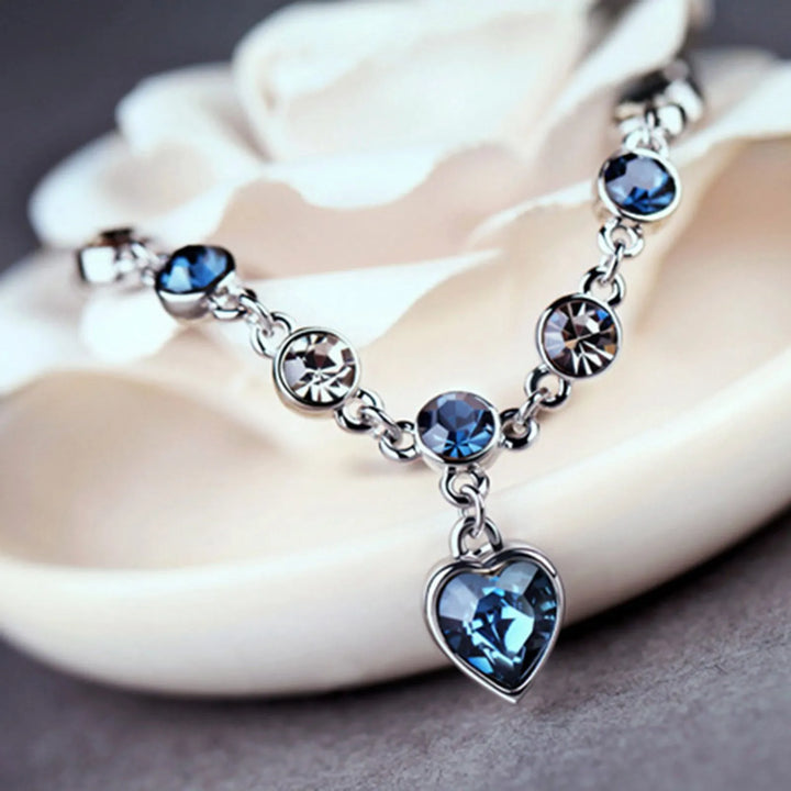 Enchanting Ocean Heart Crystal Bracelet with Radiant Blue Heart Charm Bowlift