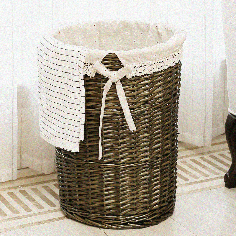 Women's laundry basket made of woven natural material with decorative fabric lining Bowlift