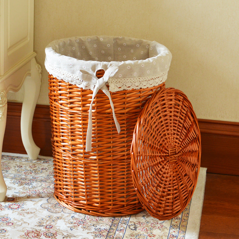 Women's laundry basket made of woven natural material with decorative fabric lining Bowlift
