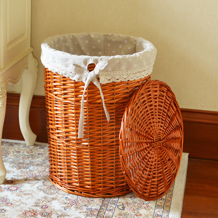 Women's laundry basket made of woven natural material with decorative fabric lining Bowlift