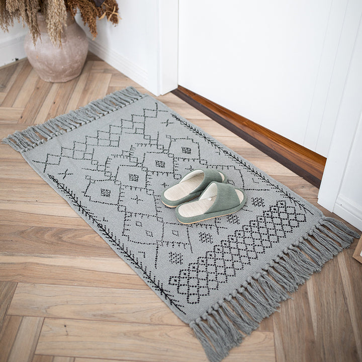 Woven cotton rug runner with flat weave structure, graphic diamond ethnic pattern and fringes