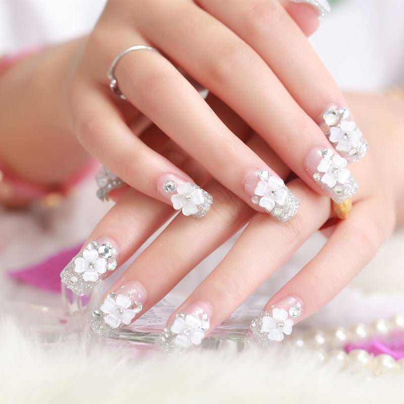 Artificial nails with glitter and floral 3D accents Bowlift