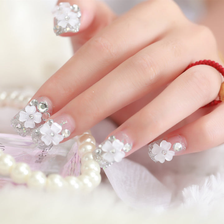 Artificial nails with glitter and floral 3D accents Bowlift