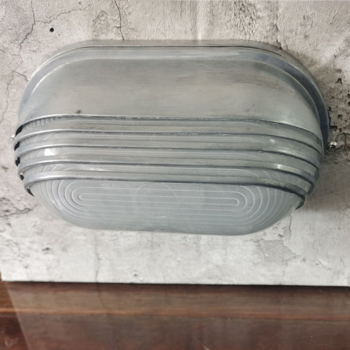 Contemporary Industrial Waterproof Aluminum Glass Frosted Oval Striped 1-Light Wall Sconce Lamp For Outdoor Patio | Bowlift