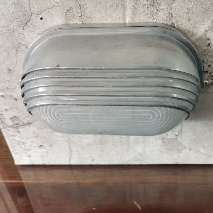 Contemporary Industrial Waterproof Aluminum Glass Frosted Oval Striped 1-Light Wall Sconce Lamp For Outdoor Patio | Bowlift