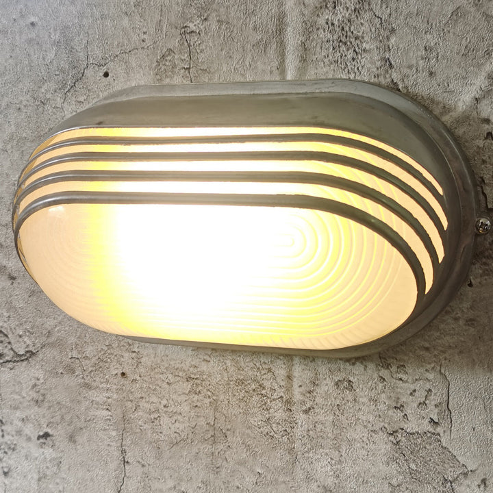 Contemporary Industrial Waterproof Aluminum Glass Frosted Oval Striped 1-Light Wall Sconce Lamp For Outdoor Patio | Bowlift