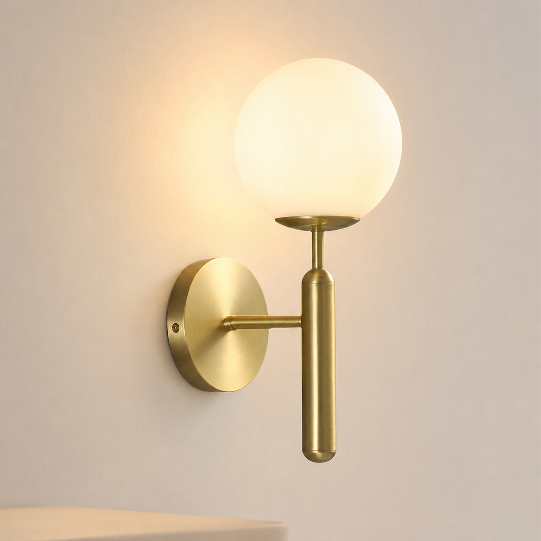 Modern wall sconce with opal glass globe and minimalist vertical stem Bowlift