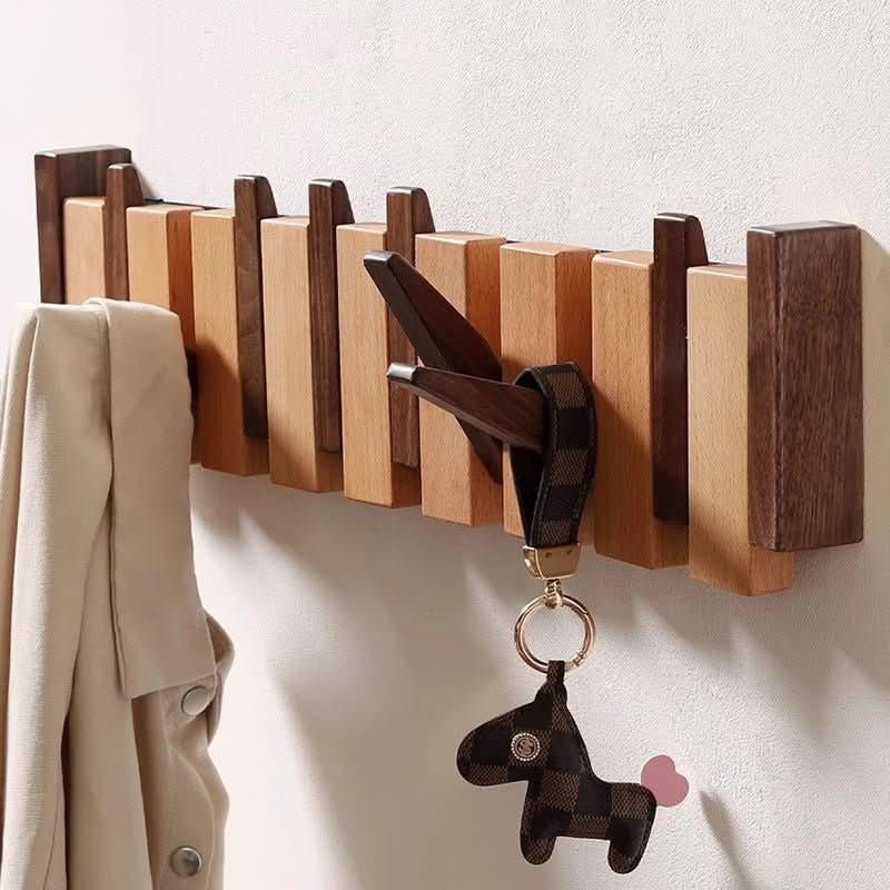 BowLift | Handcrafted piano-style wall coat rack made from walnut & beech