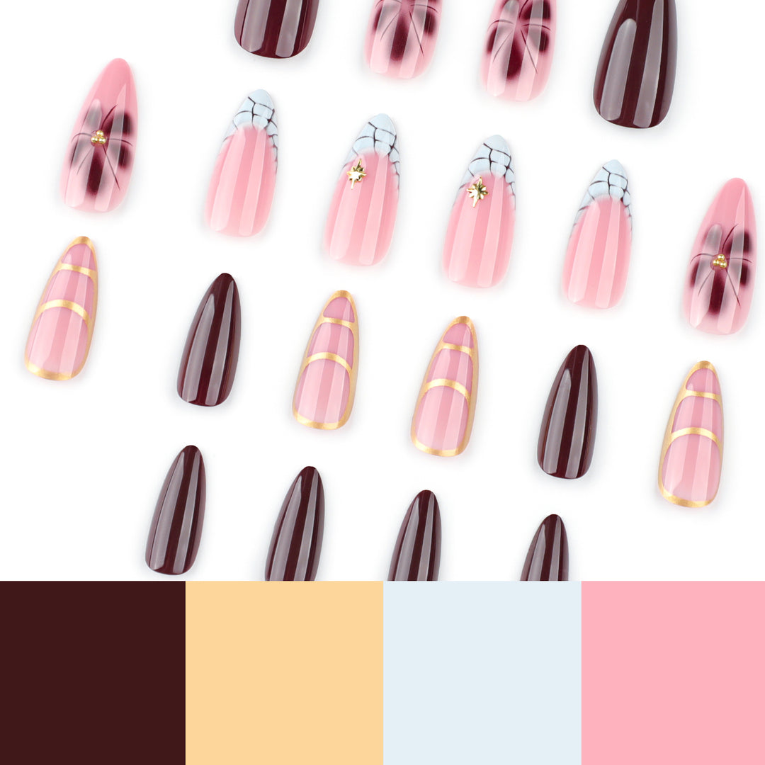 Artful Stiletto nails with gold accents and decorative floral designs Bowlift