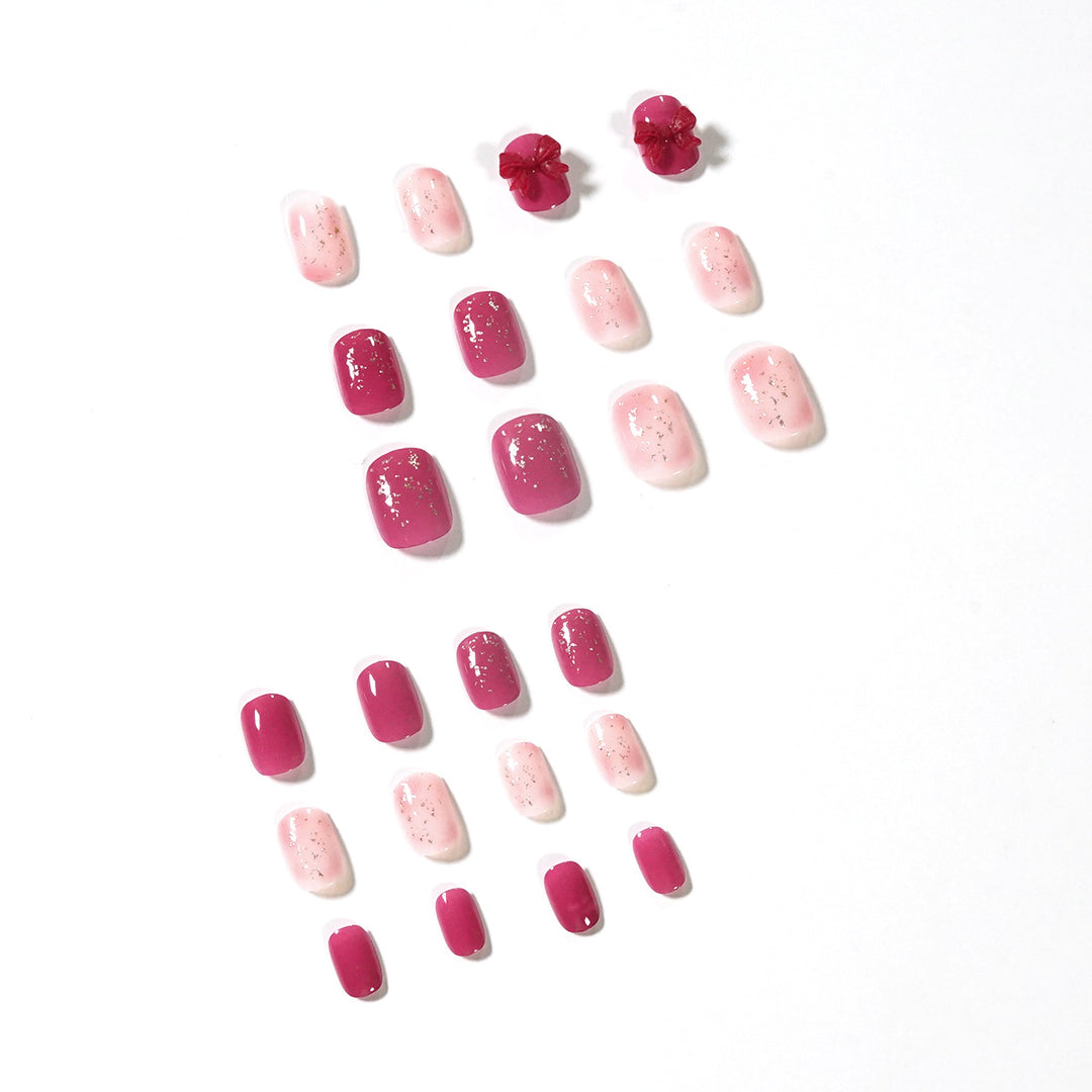 Artificial nail art with glitter embellishments and cute bow motif Bowlift