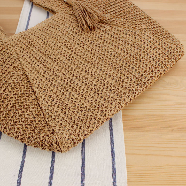 Beach bag made of natural weave with elegant leather accents Bowlift
