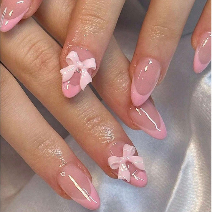 Nail art set with playful ribbons and shiny decorations Bowlift