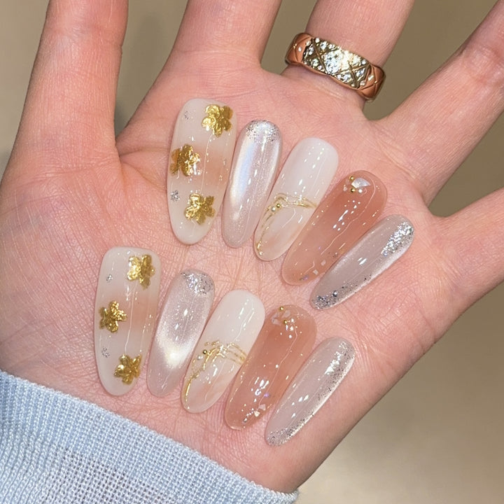 Artificial nails with floral decorations and glitter effects Bowlift