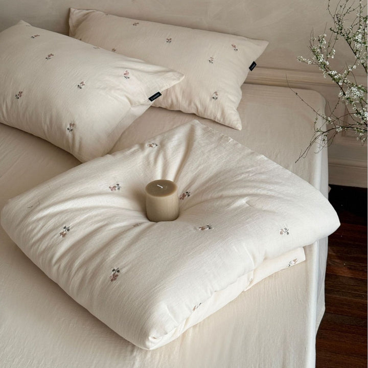 Linen bedding set with subtle floral embroidery