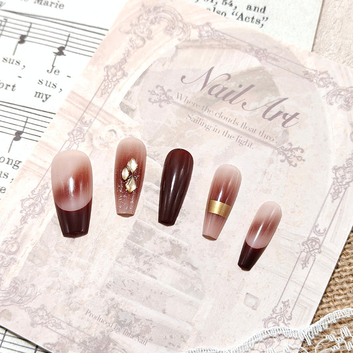 Luxurious artificial nails with glamorous decorations Bowlift
