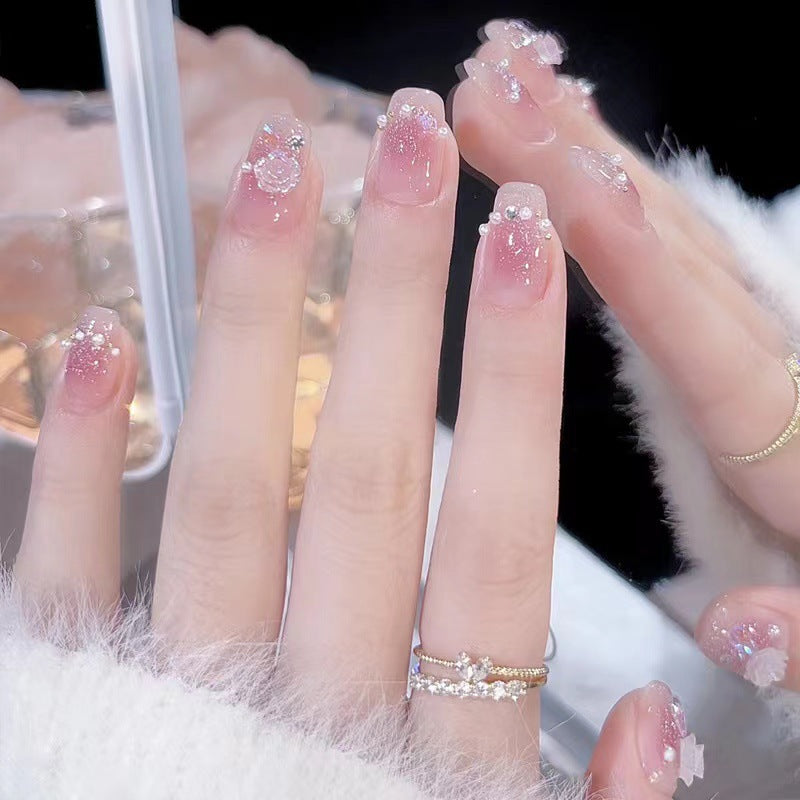 Glamorous nail art with rhinestone and pearl accents Bowlift