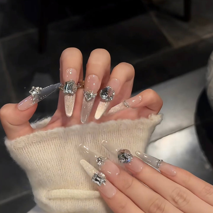 Glamorous artificial nails with sparkling rhinestone embellishments Bowlift