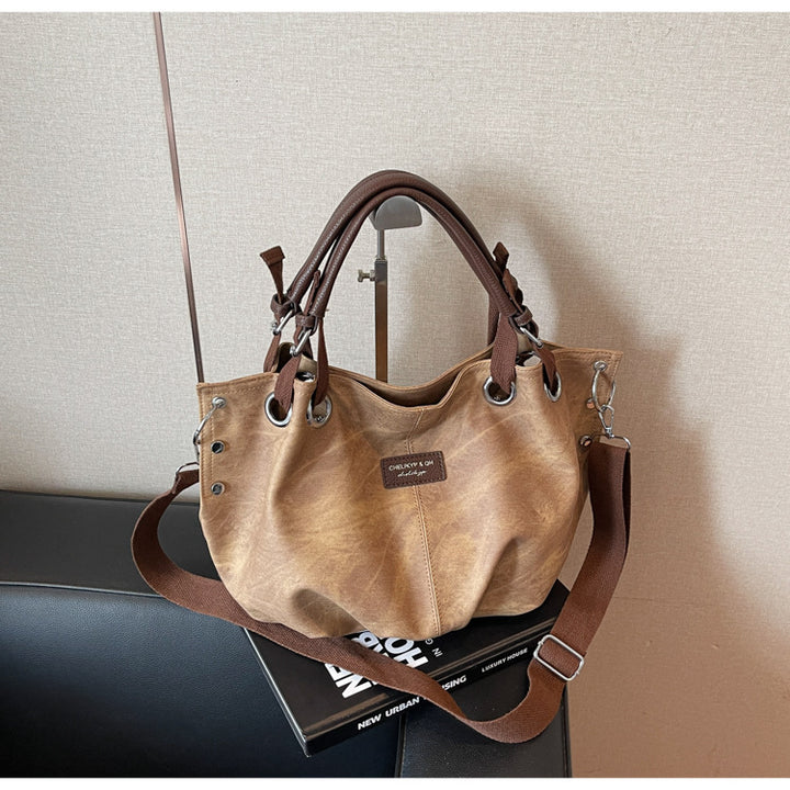 Everyday handbag with innovative carrying system Bowlift