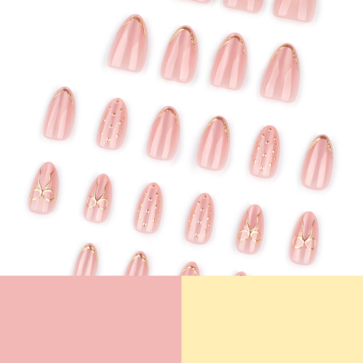 Artful nail extensions with elegant golden accents Bowlift