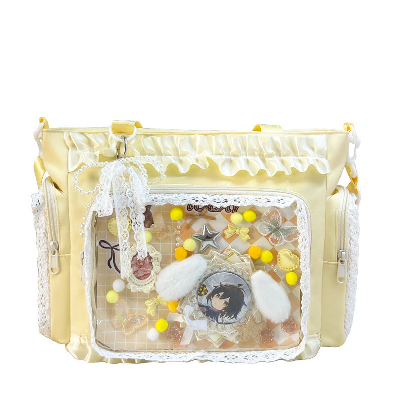 Shoulder bag with transparent front and playful applications Bowlift