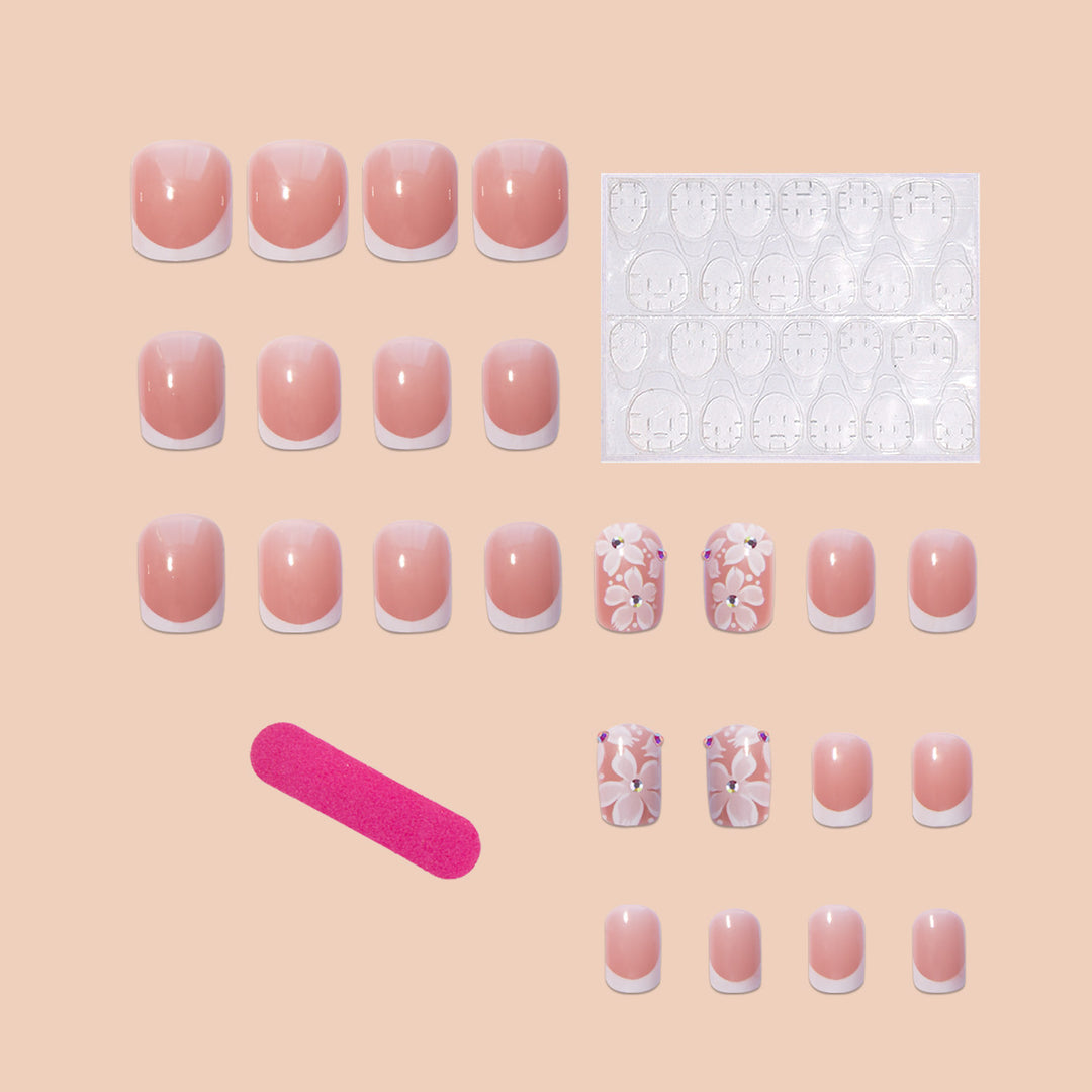 Artificial nail set with elegant French design and floral accents Bowlift