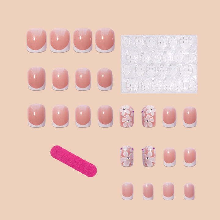 Artificial nail set with elegant French design and floral accents Bowlift