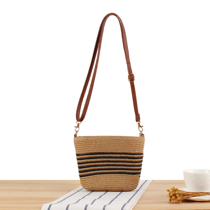 Shoulder bag made of woven natural material with contrasting stripes Bowlift