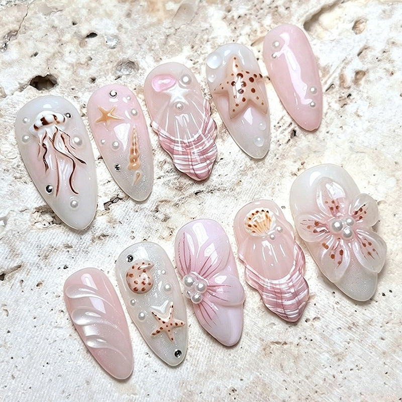 Artificial nails with maritime motifs and pearl embellishments Bowlift