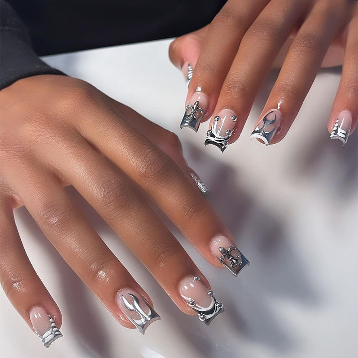 Artistic nail extensions with metallic embellishments Bowlift