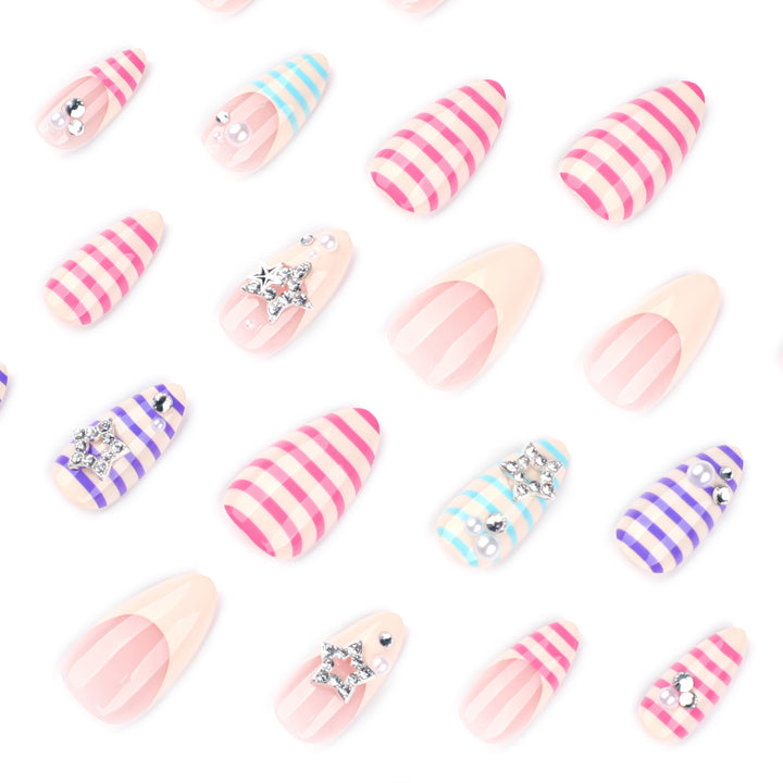 Artistic acrylic stiletto nails with glitter and star embellishments Bowlift