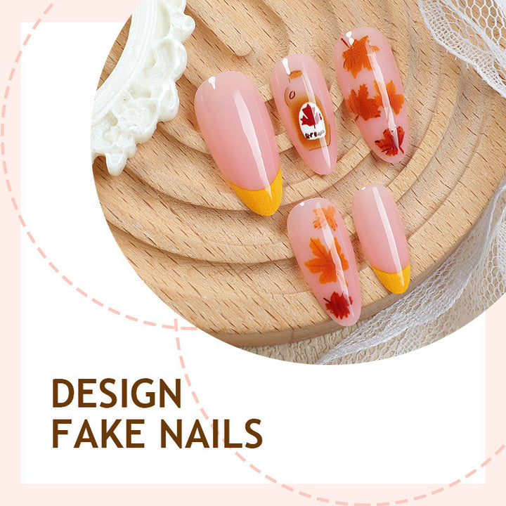 Artificial nail set with autumn leaf decorations and elegant color gradients Bowlift