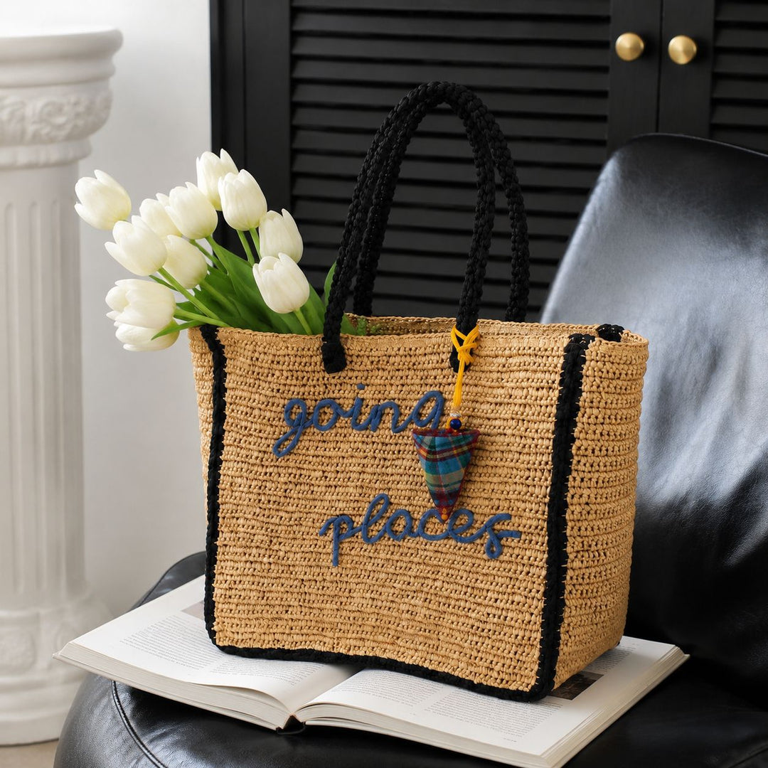 Leisure bag made of woven natural material with colorful pendant Bowlift