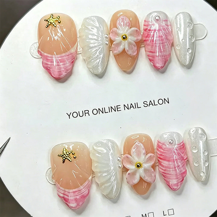 Artificial nail set with floral accents and glitter decorations Bowlift
