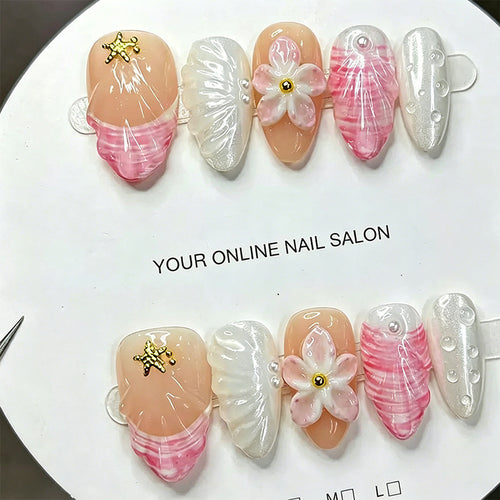 Artificial nail set with floral accents and glitter decorations Bowlift