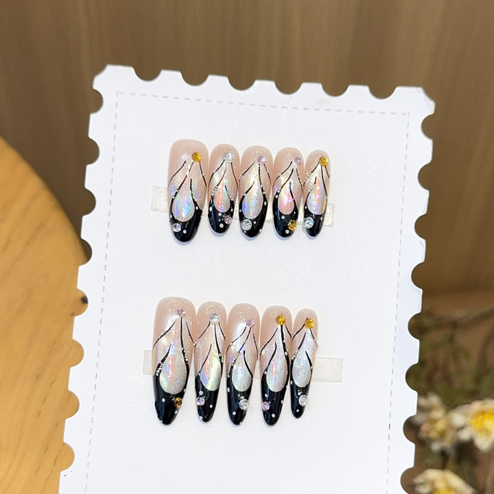 Artifical nail tips with elegant designs and glitter accents Bowlift